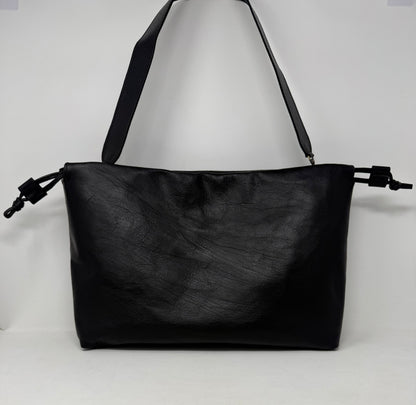 Black leather handbag on a white background