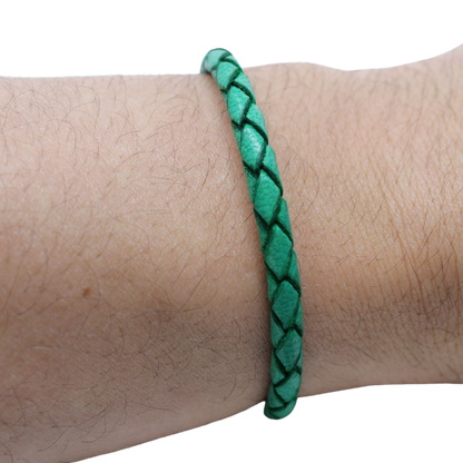 Adjustable twisted artisan leather bracelet jewelry for men and women in green on wrist by Artisan Stories