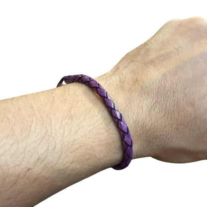Adjustable twisted artisan leather bracelet jewelry for men and women in purple on wrist