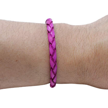Adjustable twisted artisan leather bracelet jewelry for men and women in vibrant purple on wrist