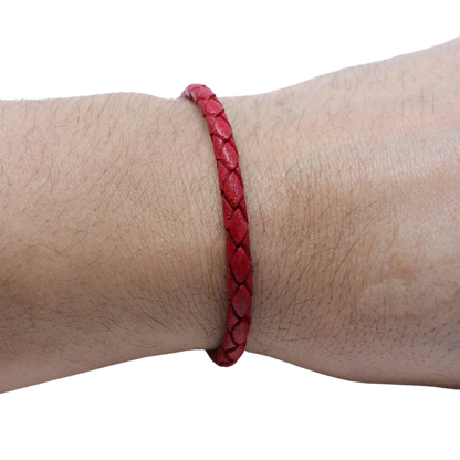 Adjustable twisted artisan leather bracelet jewelry for men and women in red on wrist by Artisan Stories
