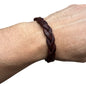 handmade braided leather bracelet in dark brown worn on wrist