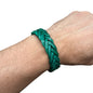 Handmade braided leather bracelet in green on wrist by Atelier Marrakech accessory