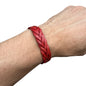 handmade braided leather bracelet in red worn on wrist