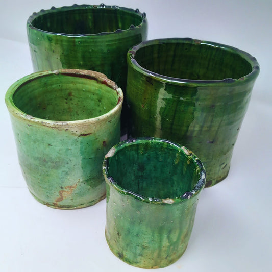 picture of four different sizes of tamegroute pots in dark green hues